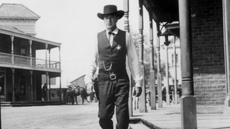 Marshall Will Kane strolling through town in "High Noon" (1952)