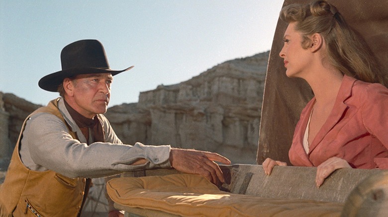 Link Jones conversing with Billie Ellis in "Man of the West" (1958)