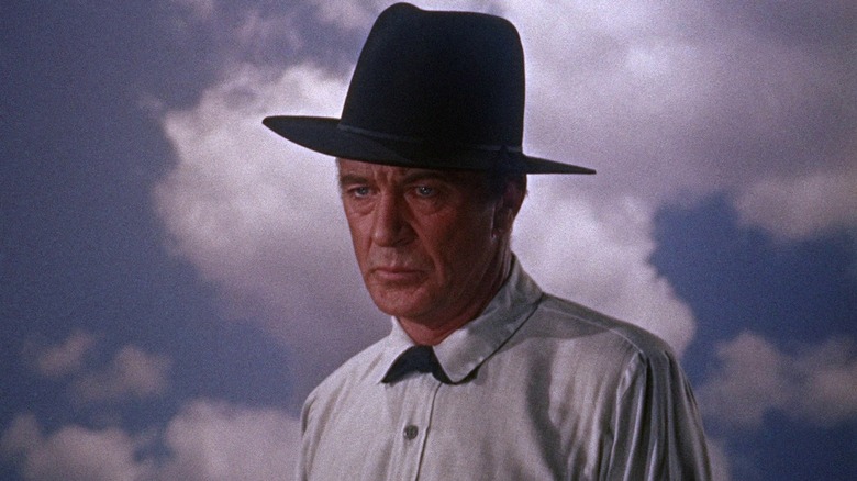 Dr. Joseph Frail looking sullen against the clouds in "The Hanging Tree" (1959)
