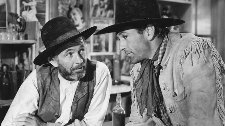 Cole Harden securing some information in "The Westerner" (1940)