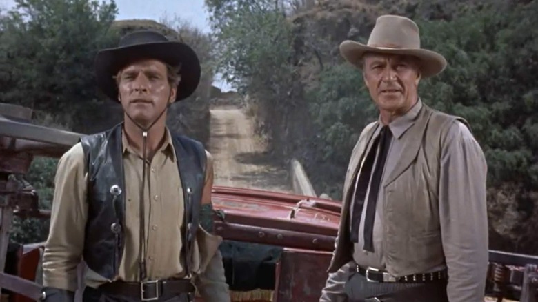 Joe Erin and Ben Trane discussing their next move next to an overturned wagon in "Vera Cruz" (1954)