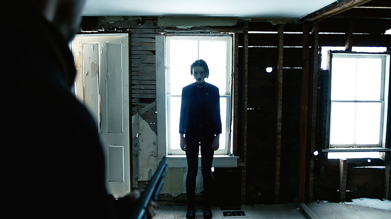 Echo's ghost stands before Kurt in his unfinished home in "The Deeper You Dig"