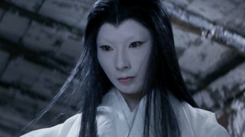 The Snow Woman casts a look down in a frozen room in "The Snow Woman"