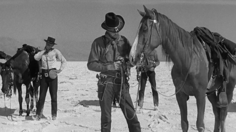 James "Stretch" Dawson tending to his horses in Yellow Sky (1948)