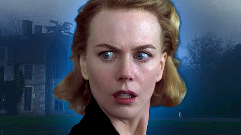 Grace Stewart stands in front of the fog-shrouded house in "The Others" (2001)