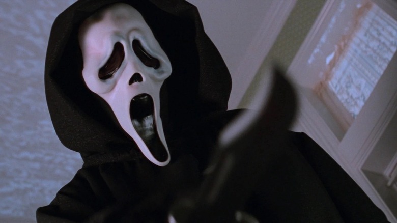 Ghostface looming over a victim in "Scream"