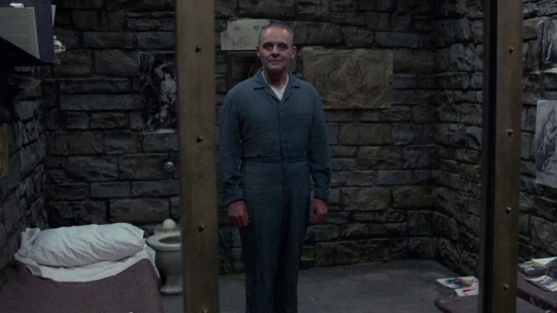 Hannibal Lecter watching as Clarice approaches his cell in "The Silence of the Lambs"