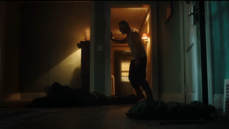 A grizzled man standing in doorway in Don't Breathe