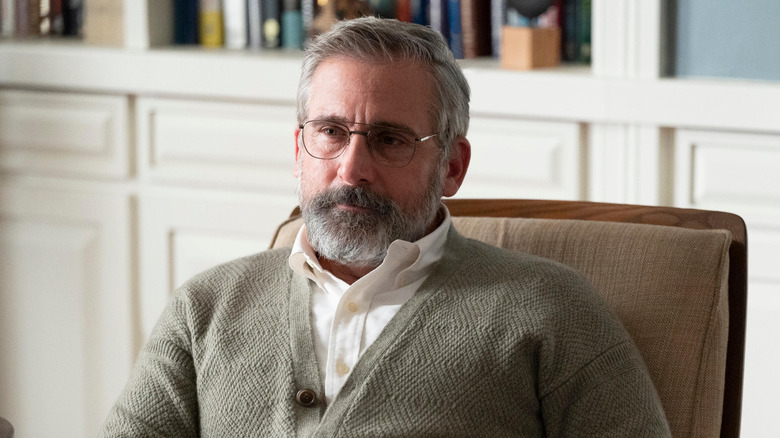 Dr. Alan Strauss smiling and sitting in a chair in "The Patient."