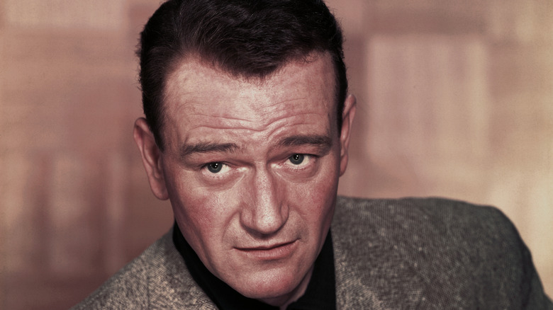 John Wayne poses for a photo