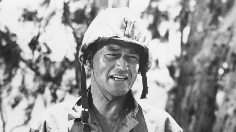 Sgt. John M. Stryker stands in the jungle in "Sands of Iwo Jima" (1949)