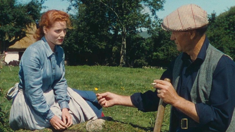 Sean Thornton offers a flower to Mary Kate Danaher in "The Quiet Man" (1952)