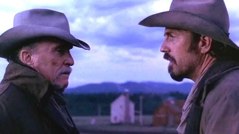 Boss Spearman and Charley Waite facing each other in Open Range