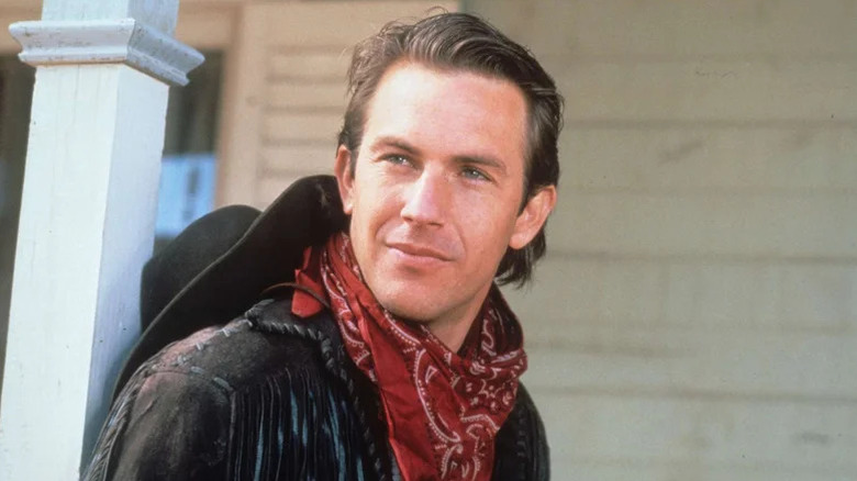 Jake looking happy and wearing a red bandanna around his neck in Silverado