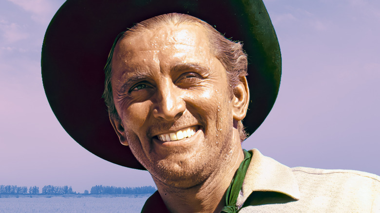 Kirk Douglas wearing a cowboy hat and sweating