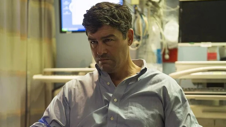 John Rayburn looking intense and wearing a scruffy shirt on Bloodline