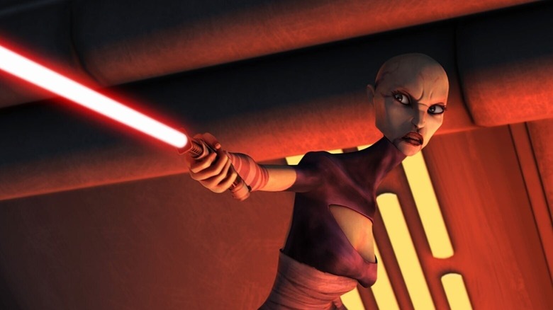 Asajj Ventress holding one of her red lightsabers in "Star Wars: The Clone Wars."