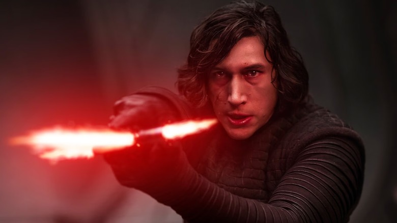 Kylo Ren pointing his lightsaber in 