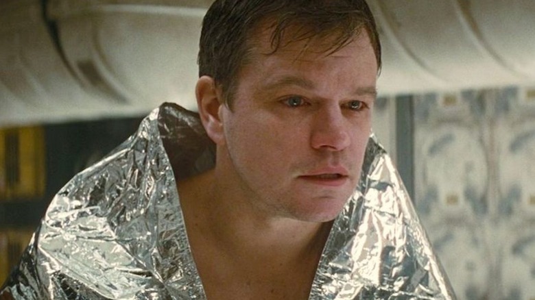 Dr. Mann wrapped in a space blanket in "Interstellar" (2014)