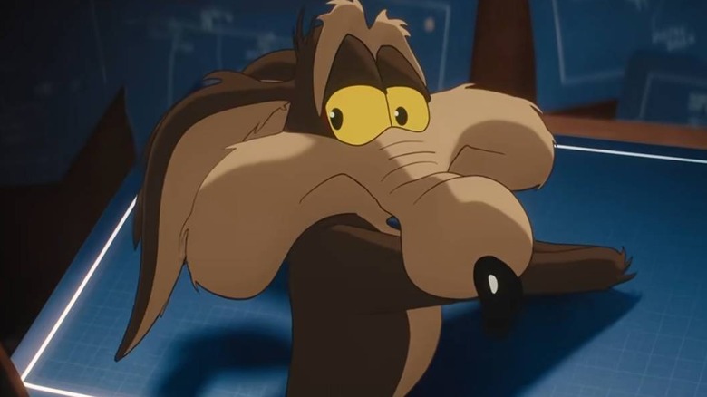 Wile E. Coyote with blueprints in Coyote vs. Acme