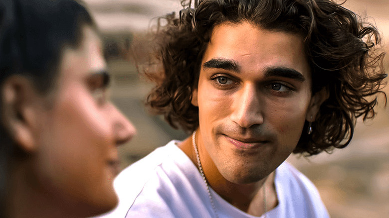 Dusty looking at a female who is slightly out of focus in Heartbreak High (2022)