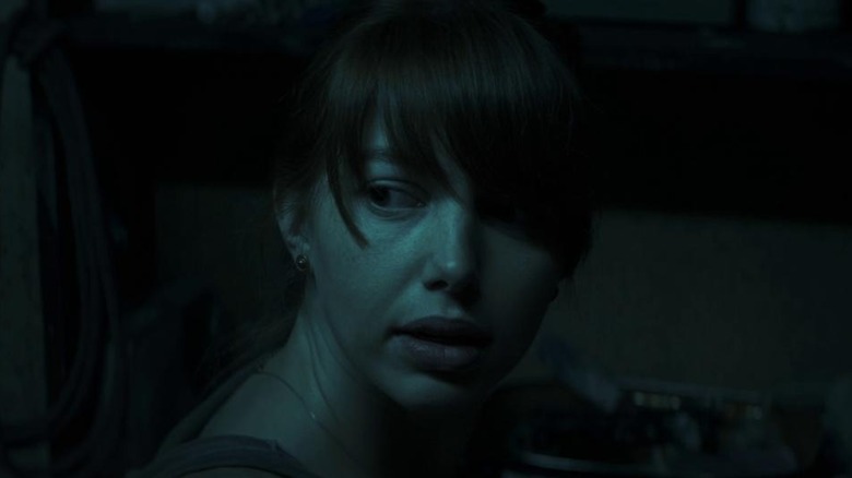 Sarah O'Neill basked in blue light in The Hole in the Ground