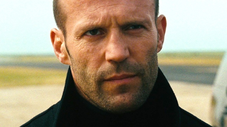 A close up of Bishop as he attends a secret meeting in The Mechanic
