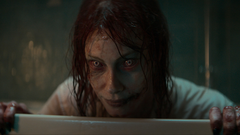Ellie staring out from a tub in Evil Dead Rise