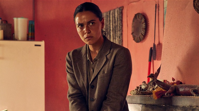Detective Dalia Zaki looking around cautiously in Lee Cronin's The Mummy