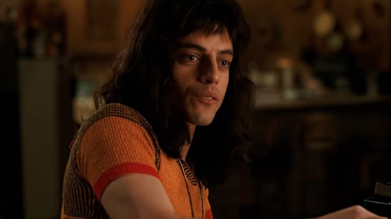 Freddie in a ribbed orange sweater in Bohemian Rhapsody (2018)