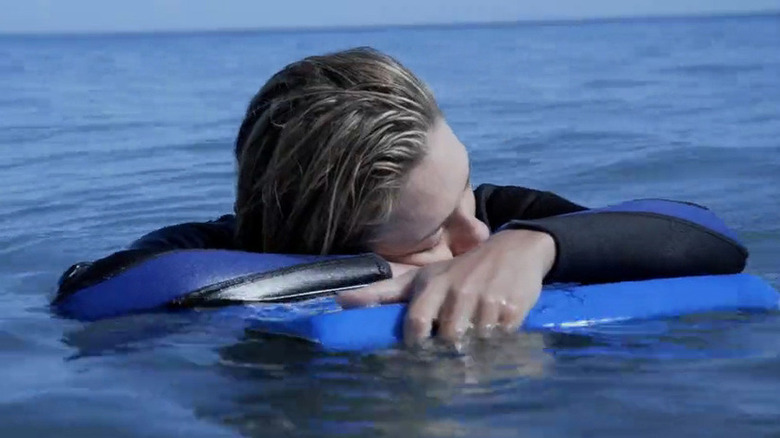 Kate sleeping on her boogie board in The Reef (2010)
