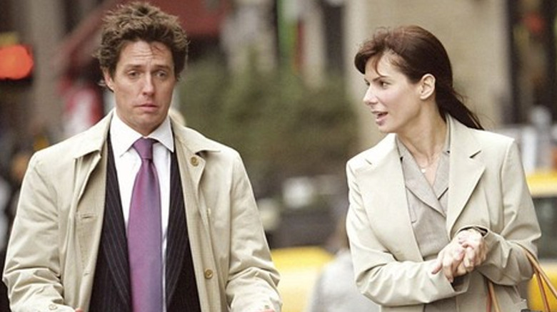 Lucy and George walk and talk in "Two Weeks' Notice"