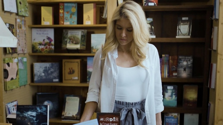 Natalie shopping at a book store in The Book Club Murders (2024)