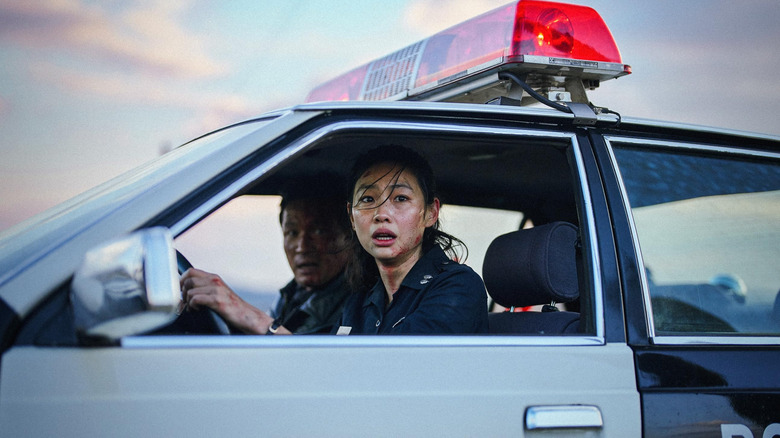 Sung-ae horrified driving her cop car in Hope