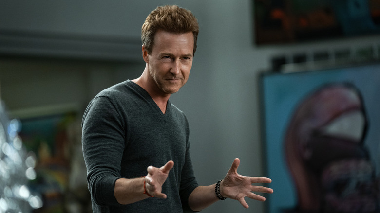 Miles Bron sneering and gesticulating in a tech CEO gray sweater in Glass Onion (2022)