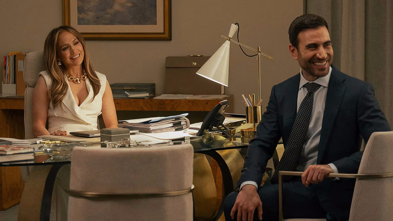 Jackie and Daniel in the office laughing in Office Romance