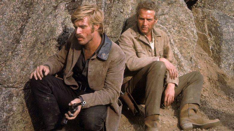Sundance Kid and Cassidy sitting against a rock in Butch Cassidy and the Sundance Kid