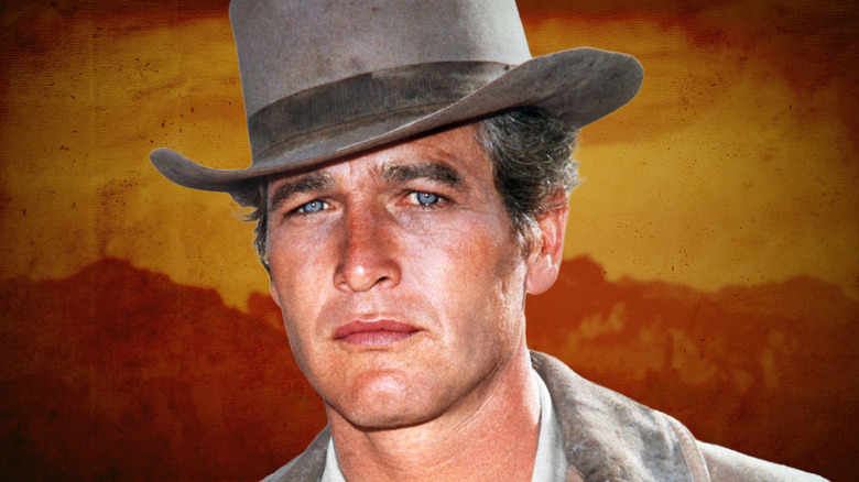 Paul Newman in a cowboy hat with an orange background