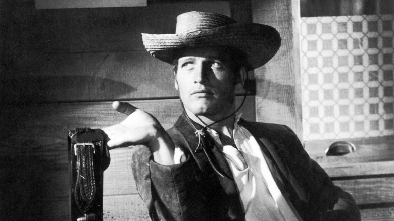 Billy holding a gun belt in The Left-Handed Gun