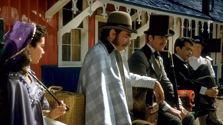 The main characters of Around the World in 80 Days taking a rest (1956)