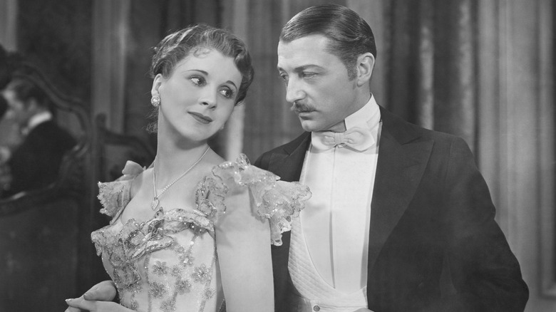 Jane and Robert Marryot holding each other close in Cavalcade (1933)