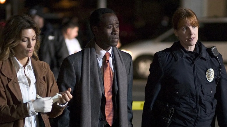 Detective Graham Waters investigating a crime scene in Crash (2004)