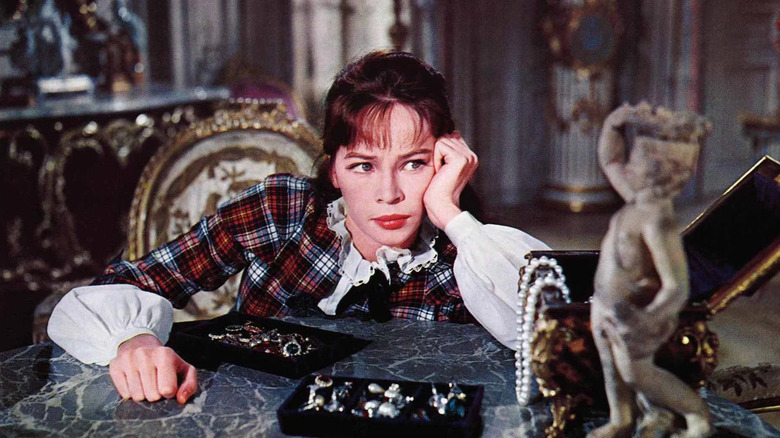Gigi looking at a statue in Gigi (1958)