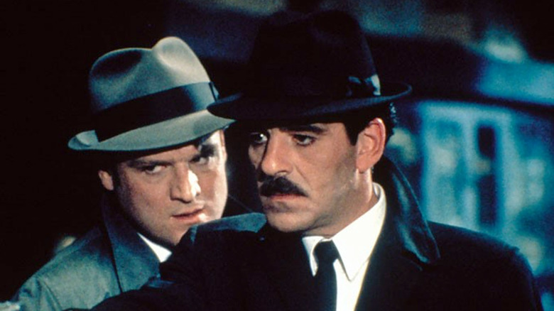 Krychek looking over Trello's shoulder in Crime Story (1986)