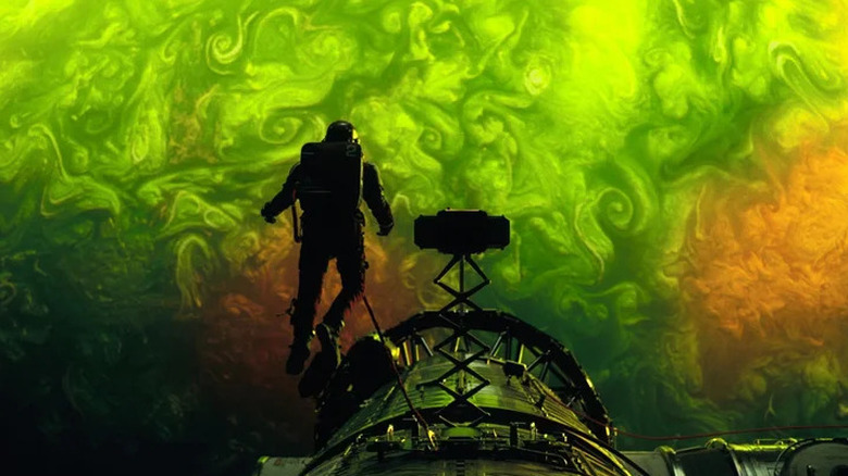 Ryland Grace on a space walk looking at a swirling green wall of energy in Project Hail Mary