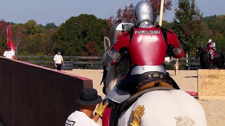 A knight sits on a white horse preparing to joust in Full Metal Jousting (2012)
