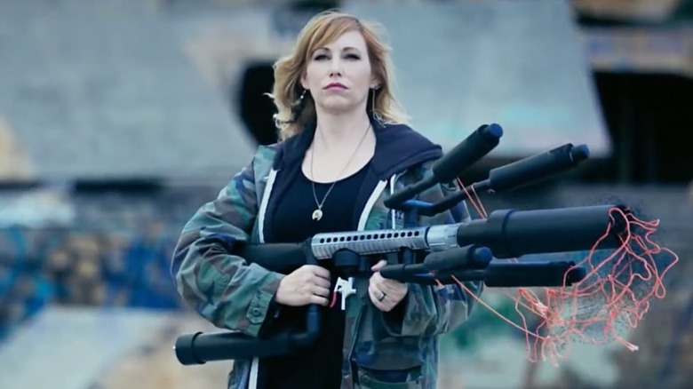 Kari holding a makeshift weapon in White Rabbit Project (2016)