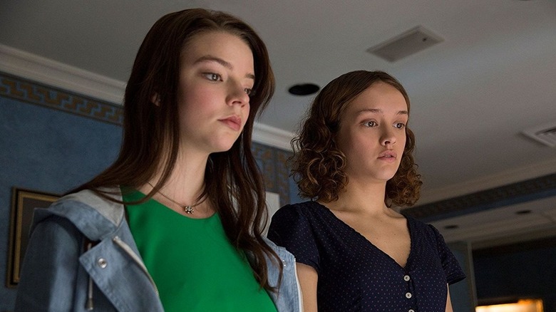 Lily and Amanda looking at something in Thoroughbreds