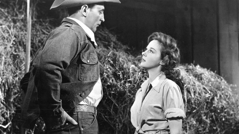 Jeff McCloud looking down at Louise Merritt in The Lusty Men (1952)