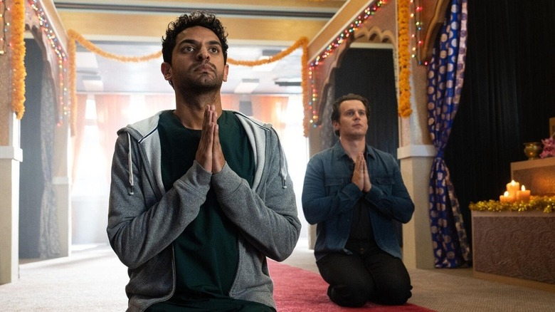 Naveen and Jay praying in the same temple in A Nice Indian Boy (2025)